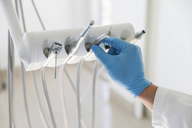 Professional Tooth Extraction technician working in Fayetteville, NC